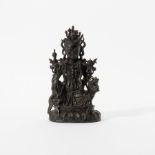 A bronze Guanyin on a mythical animal