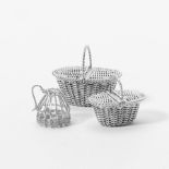 A  miniature silver basket with two ducks and two oval miniature shopping baskets of woven silver