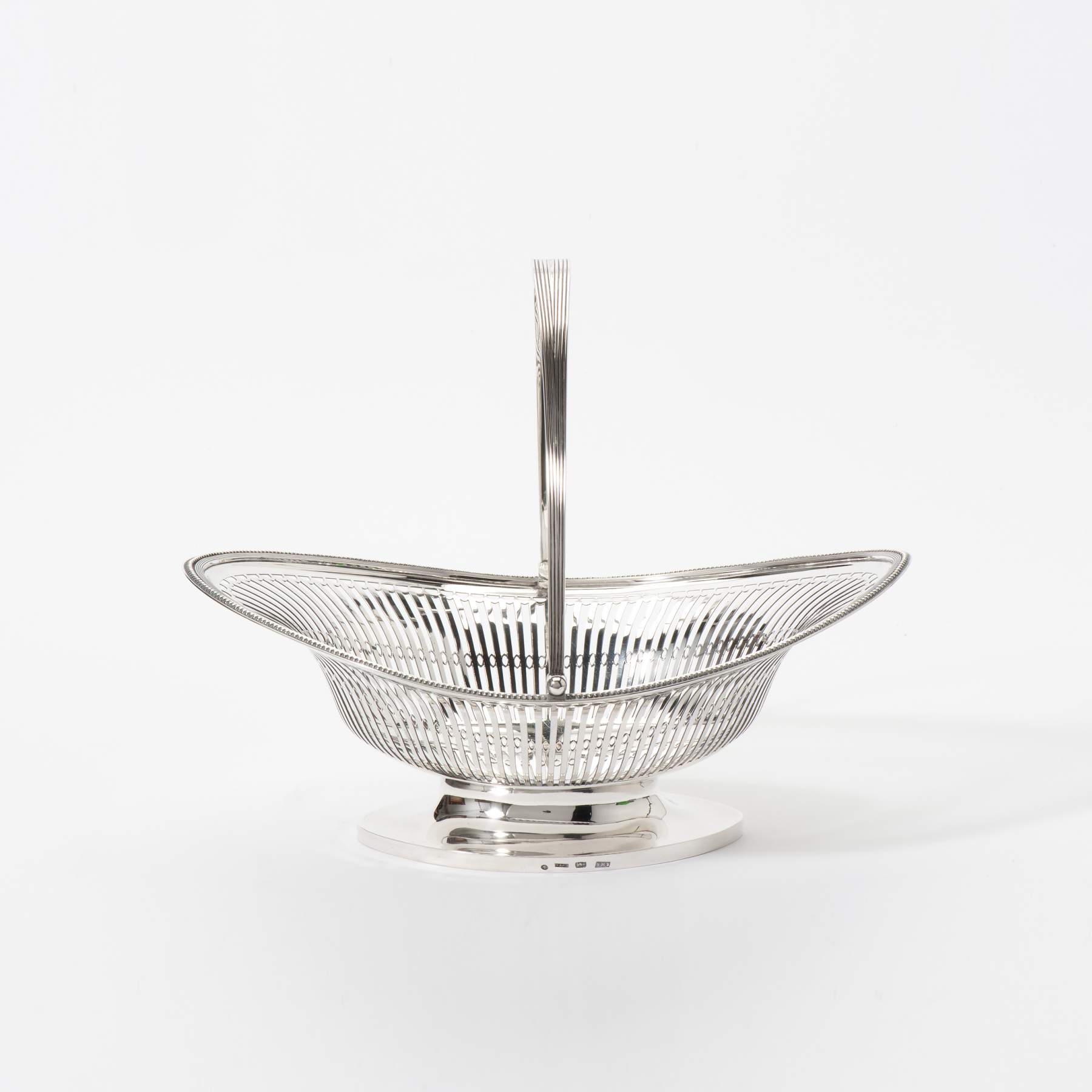 A boat-shaped silver Empire pastry basket with hinged handle