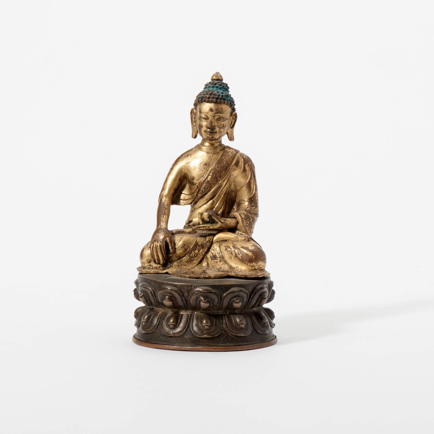 A part gilt bronze enthroned Buddha