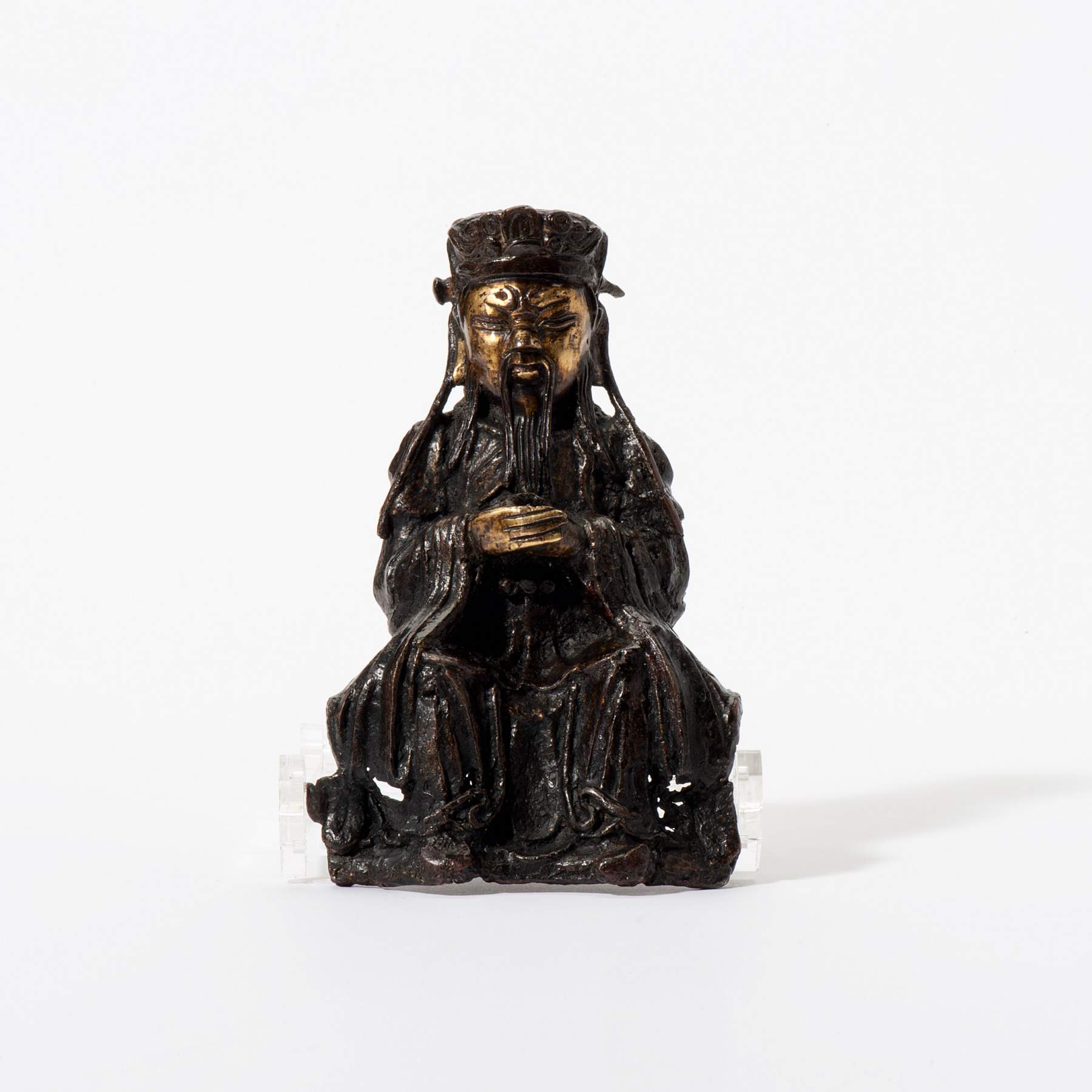 A seated bronze dignitary