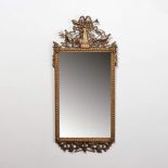 A large rectangular Louis XVI mirror in gilded wooden frame