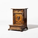 A walnut 'prie-dieu'  Italy, 17th century The front with a door with carved cherub underneath a