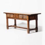 A rectangular walnut table  Spain, 17th century With three drawers featuring carved lozenges and