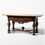 A rectangular walnut table  Germany, dated 1705 Chamfered corners, two drawers, between the