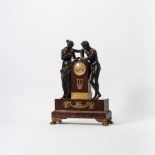 A patinated and gilt bronze and red marble Empire mantel clock  Paris, first quarter 19th century,