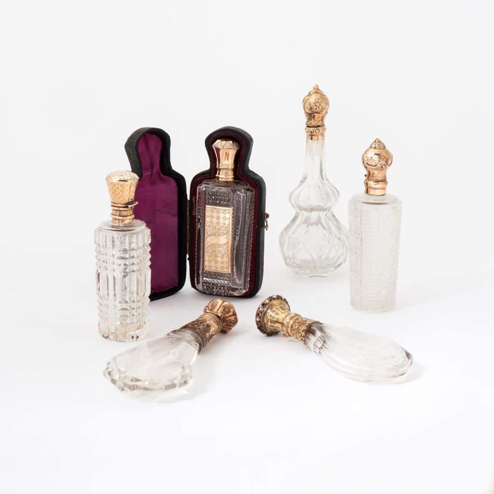 Six crystal scent bottles with golden stoppers 19th century Two with interior stopper. One with