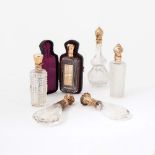 Six crystal scent bottles with golden stoppers 19th century Two with interior stopper. One with