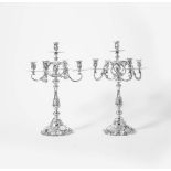 A pair of three-part silver rococo style five-light candelabra 20th century, pseudo Amsterdam