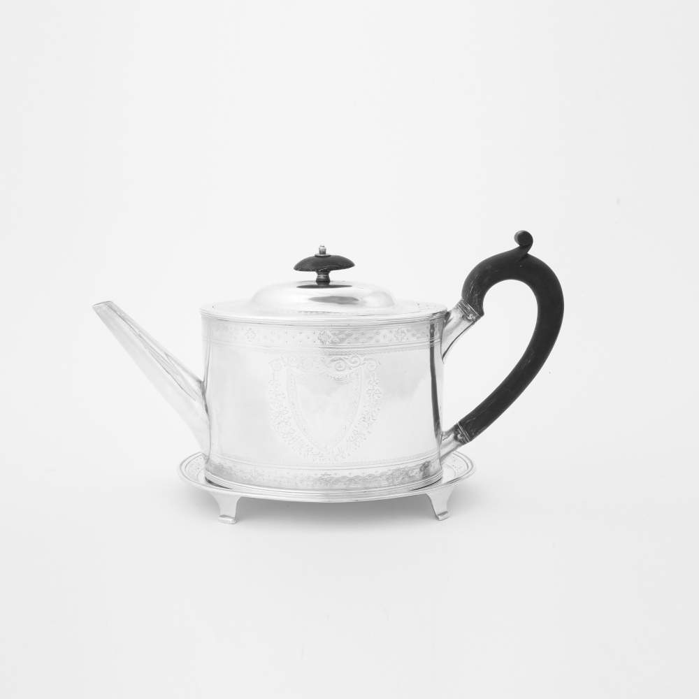 An oval silver George III teapot with lid and coaster London, 1789, Hester Bateman and London, 1783,