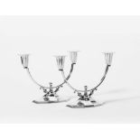 A pair of Danish silver two-light candelabra Copenhagen, 1934, Jens Sigsgaard The ten-sided foot