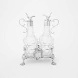 A silver George II cruet set London, 1758, John Delmester The stand with handle and on four shell-