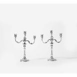 A pair of silver candlesticks 'à double usage' Circa 1770, possibly  Baltic, maker's mark GB The