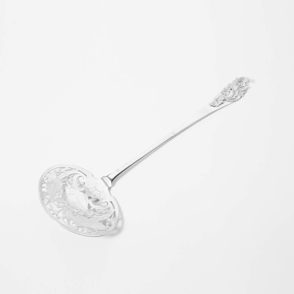 A silver fish scoop Leiden, 1771, unclear maker's mark The scoop openwork in the form of three fish,