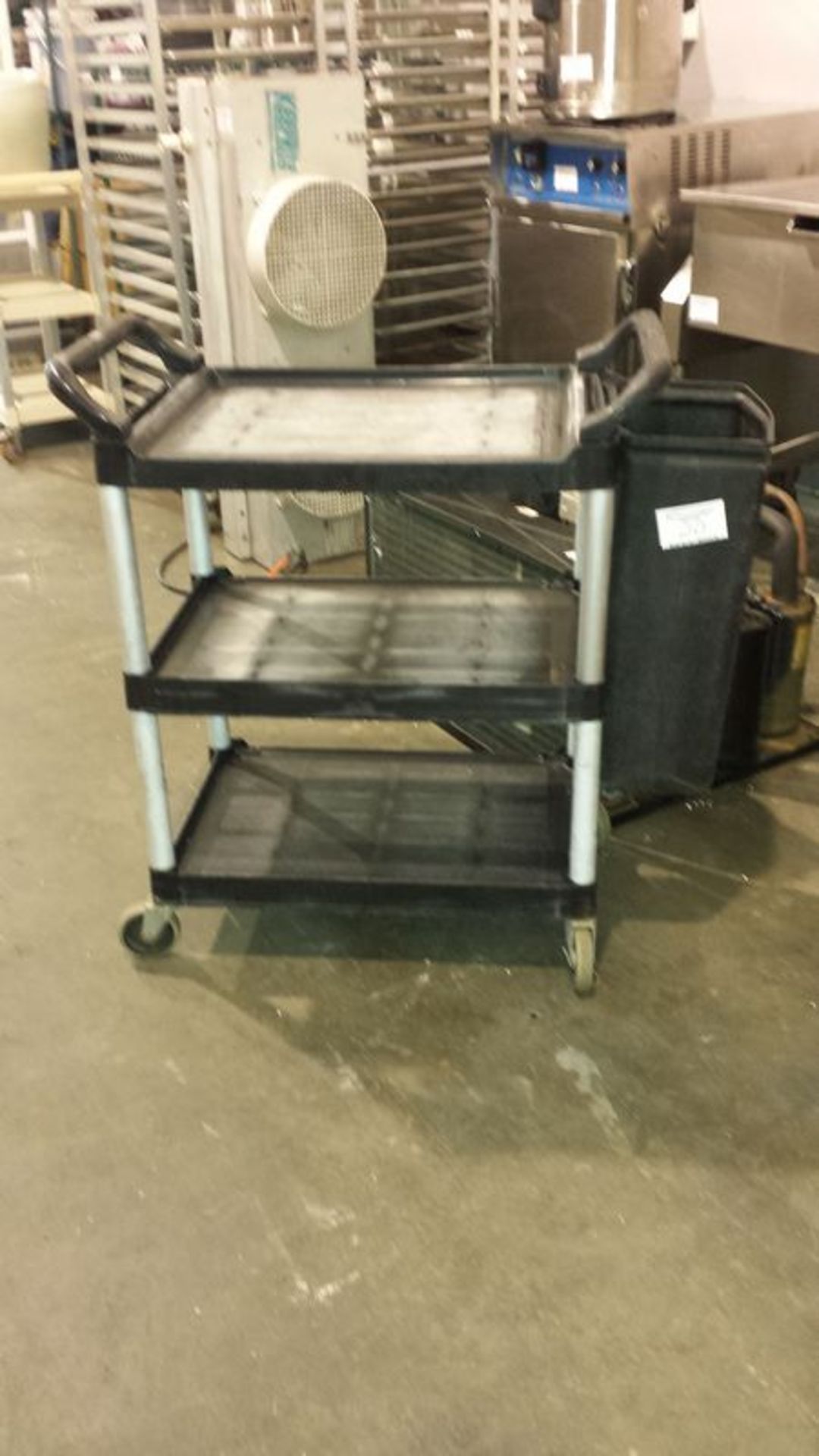 3 Tier Rubbermaid trolley with garbage can