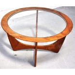 A G-plan circular coffee table with cent