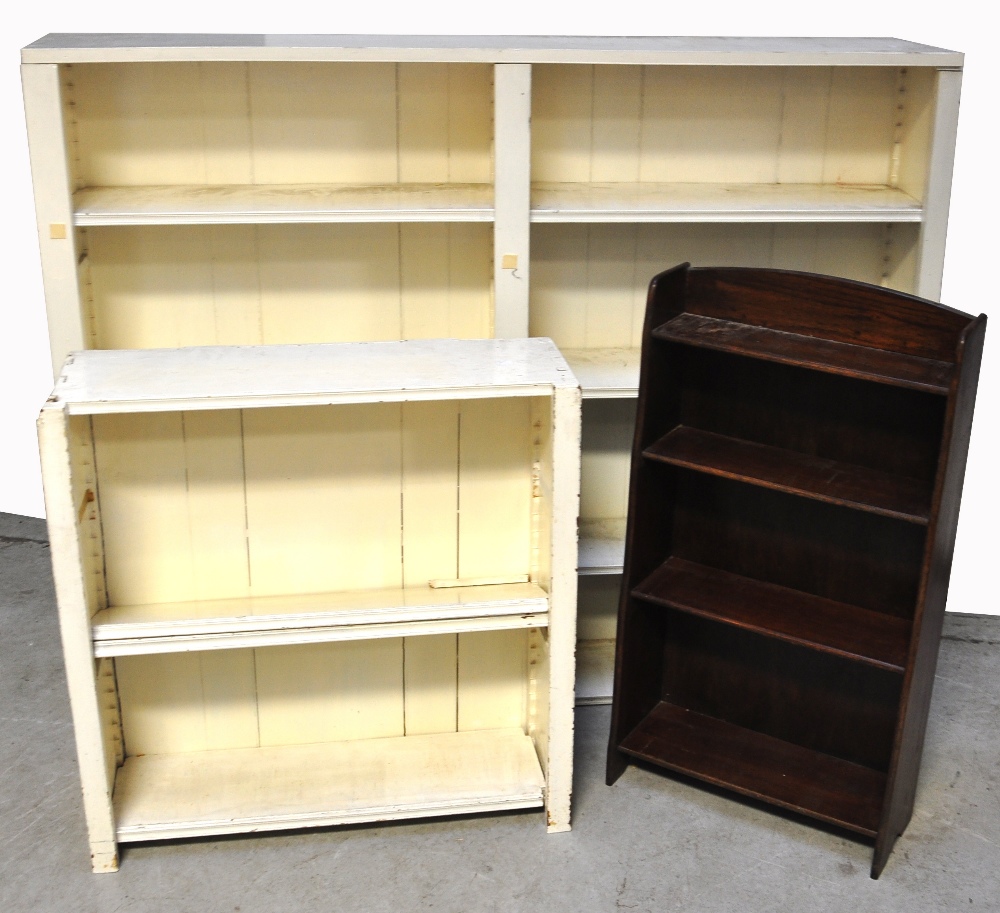 A large white painted bookshelf with fou
