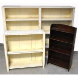 A large white painted bookshelf with fou