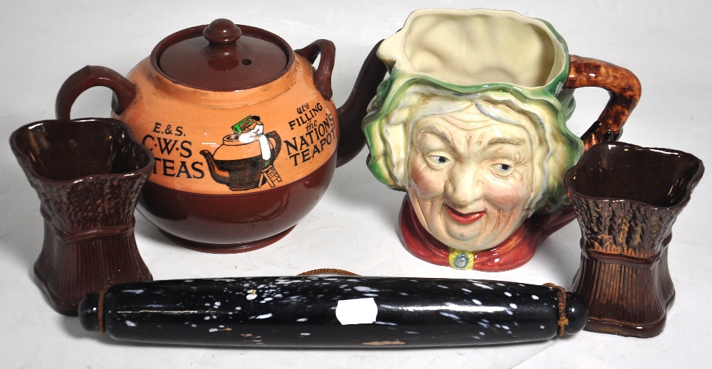 A Nailsea type rolling pin, a Beswick Sa