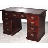 An Edwardian walnut twin pedestal desk,