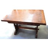 A retro oak draw leaf table with carving