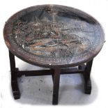 A 20th century Oriental carved wood and glass topped collapsible table, height 51cm. CONDITION