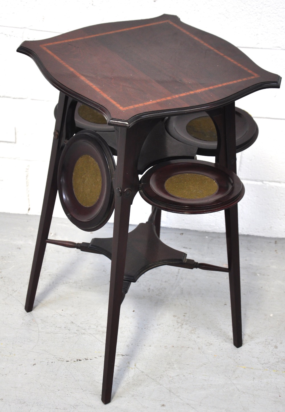 An Edwardian mahogany satinwood inlaid Art Nouveau design occasional table/cake stand, the