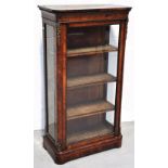 A good mid-Victorian walnut pier cabinet, the rounded rectangular top above inlaid frieze and glazed