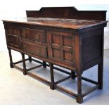 A 20th century Jacobean style oak sidebo