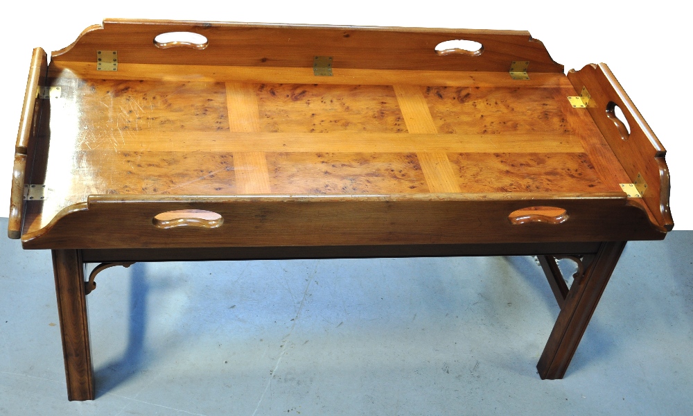 A reproduction Titchmarsh & Goodwin yew wood coffee table with butlers tray style hinged top and