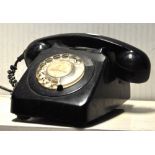 A vintage black telephone.