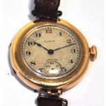An Elgin vintage ladies gold plated watch, the circular dial set with Arabic numerals and subsidiary