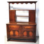 An early 20th century oak dresser, the a