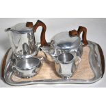 A retro Picquot ware tea service to include tray, tea pot, coffee pot, milk and sugar. CONDITION