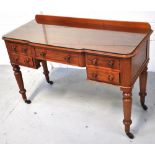 A late Victorian mahogany writing table/