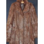 A ladies retro musquash fur coat.