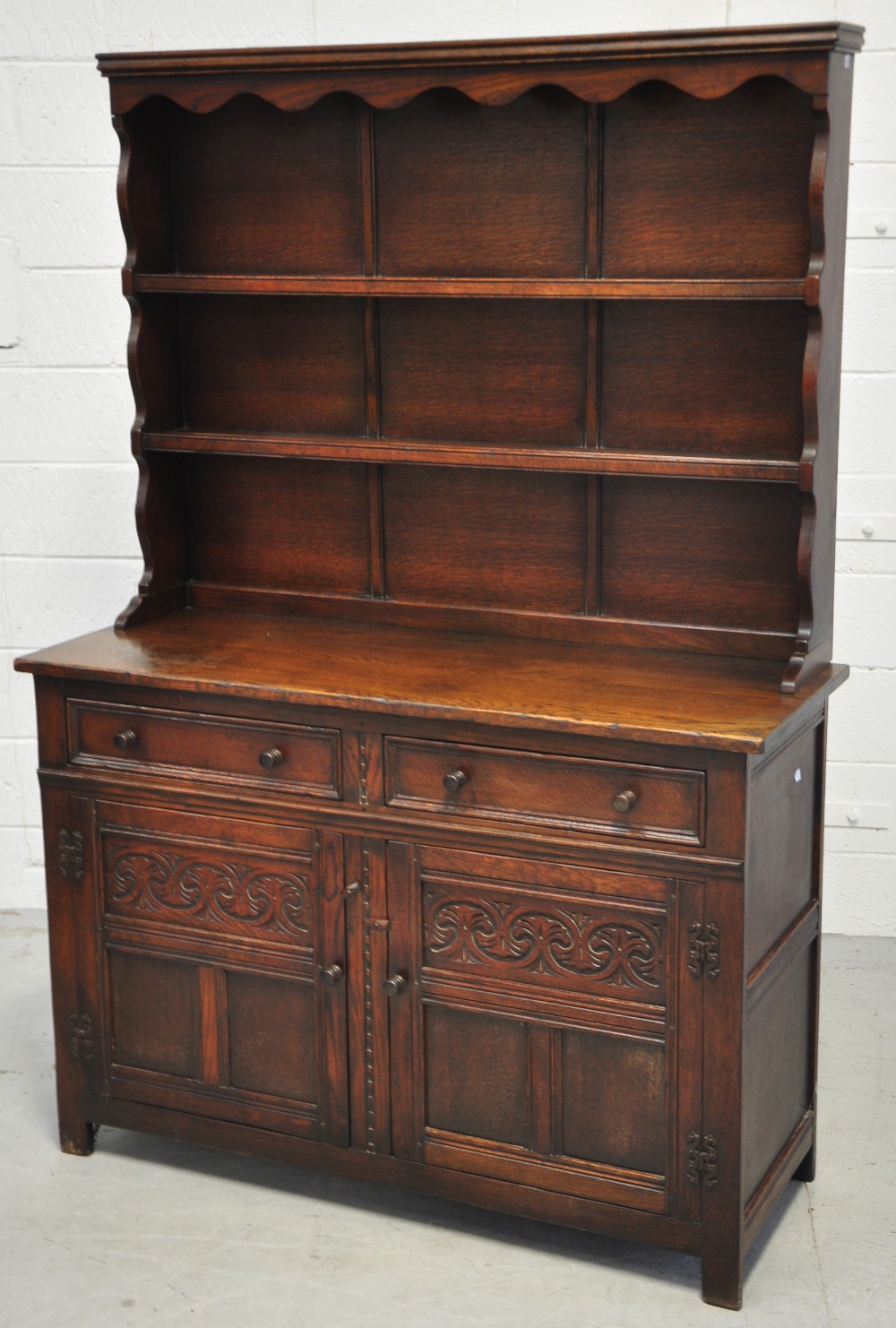 A reproduction oak dresser with boarded