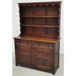 A reproduction oak dresser with boarded