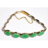 A 14ct gold and jadeite set bracelet com