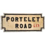 A cast iron street sign "Portelet Road L