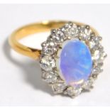 An 18ct gold opal and diamond ring, the