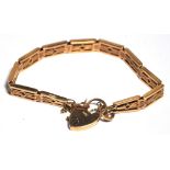 A 9ct gold link bracelet with padlock cl