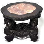 A heavily carved Chinese hardwood two tiered stand with shaped rouge marble insert, height 22 x