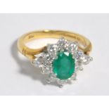 An 18ct gold emerald and diamond floral