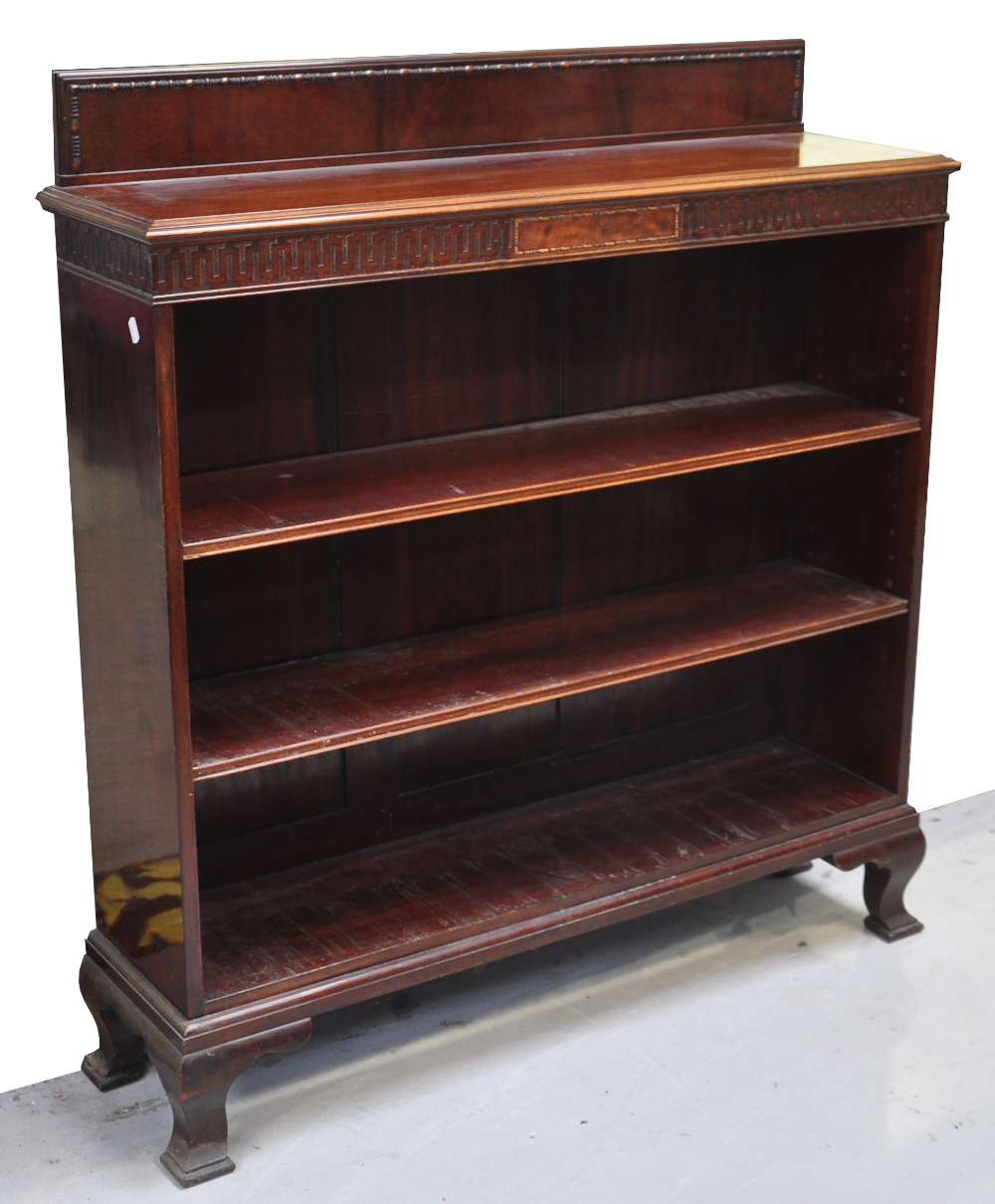 An Edwardian mahogany open bookcase, the