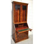 A reproduction walnut veneered bureau bo