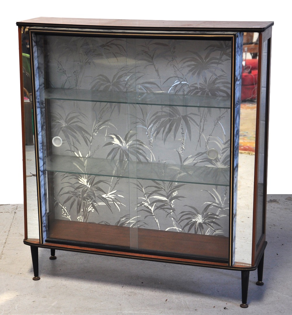 A retro 1950s cocktail cabinet with glaz