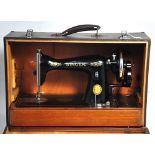 A 20th century cased black Singer sewing