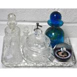 A cut glass dressing table tray with various cut glass dressing table bottles and a cut glass