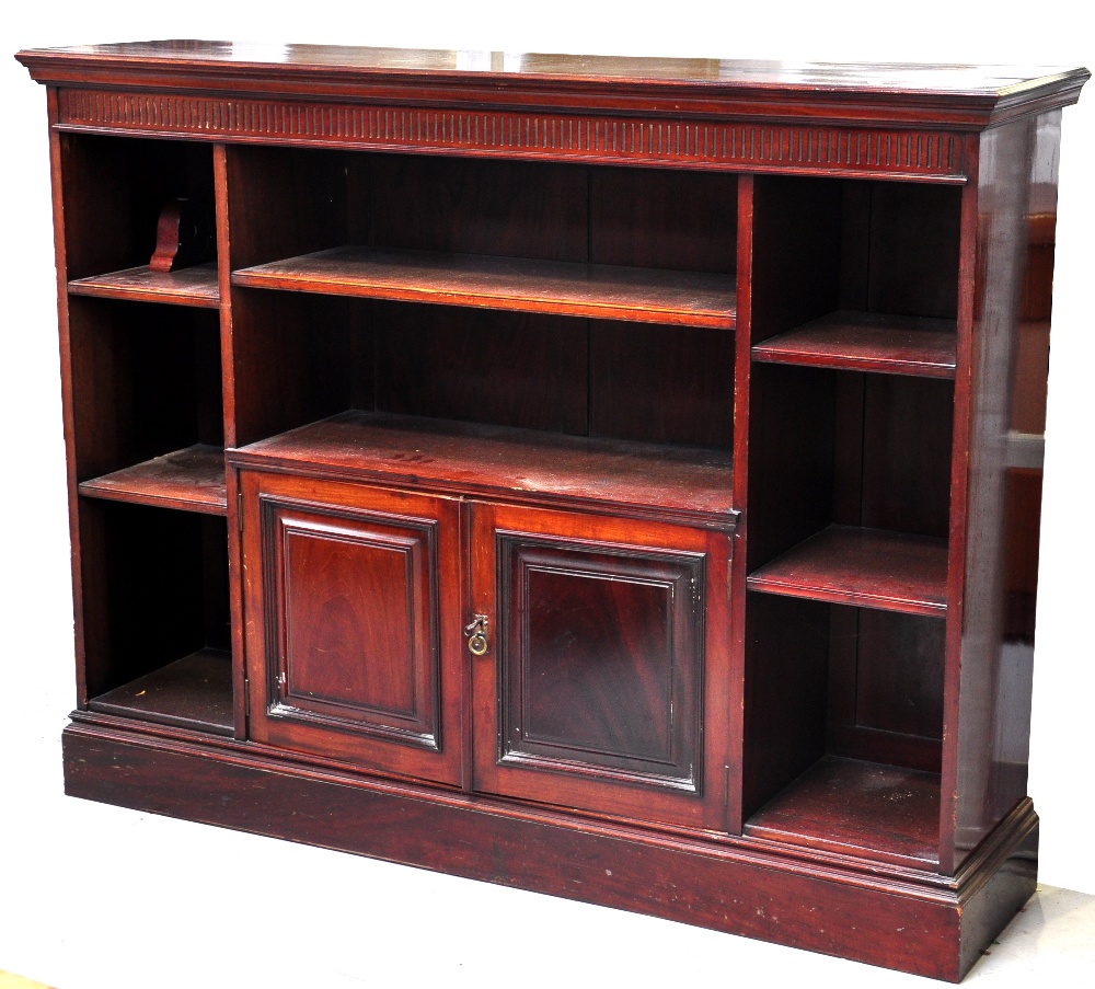 An Edwardian mahogany open bookcase, the